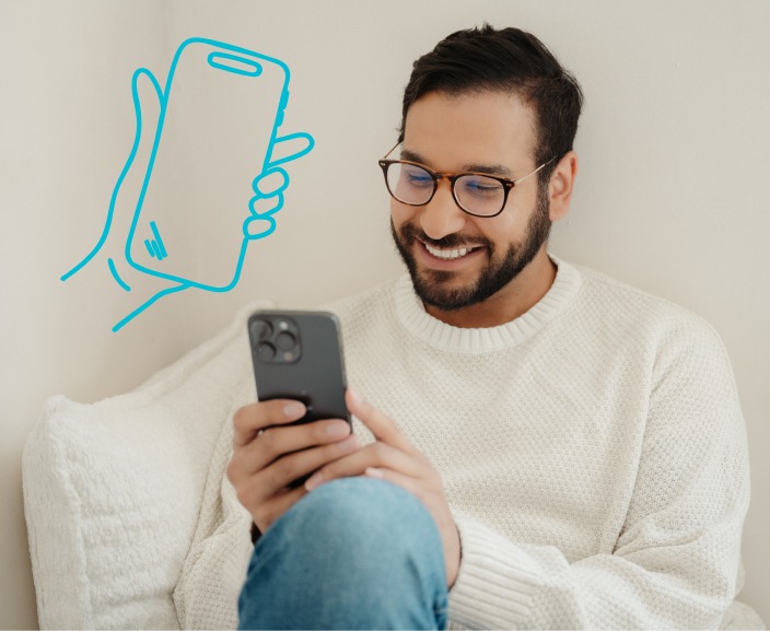 Man in white sweater smiling while looking at smartphone, with blue illustrated outline of a hand holding a phone in the background