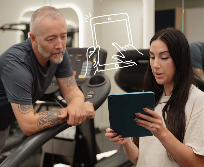 Healthcare professional showing tablet to patient while explaining treatment options in medical office